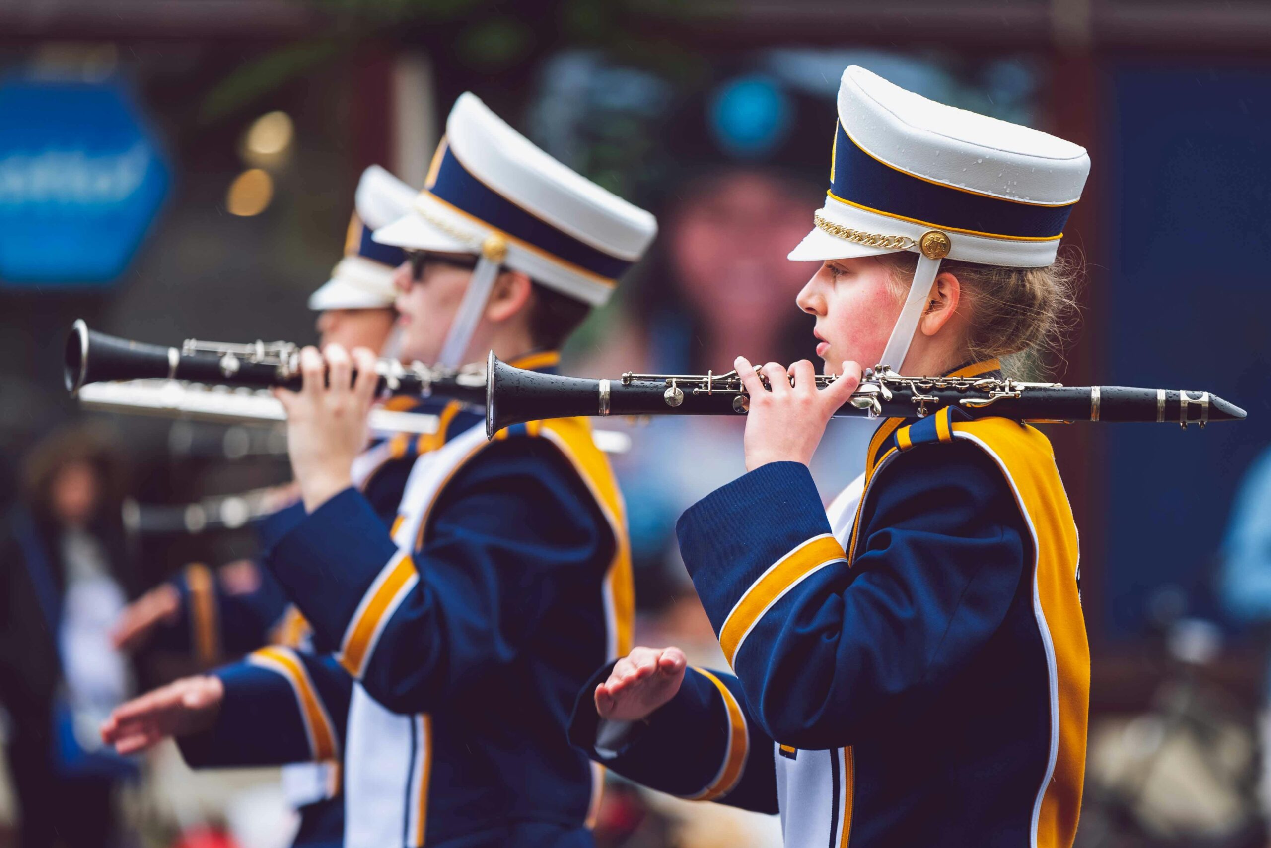 Home Marching band in uniform playing clarinets during a parade in Victoria, BC.