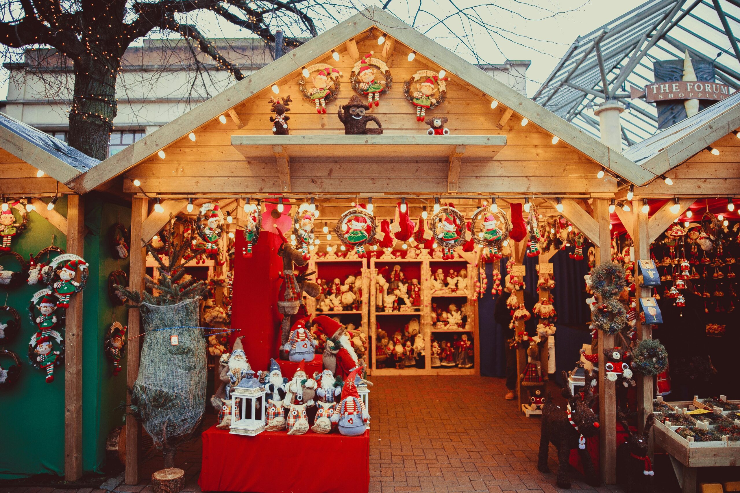 Parade Day Activities Charming Christmas market stall filled with decorations and festive cheer.